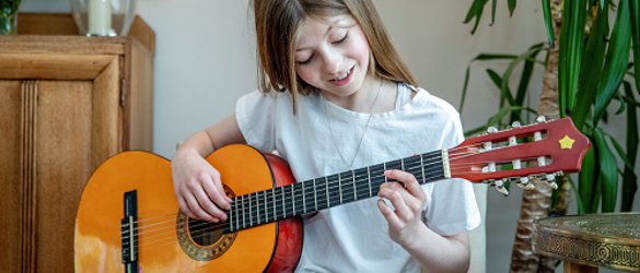 Freya playing the guitar