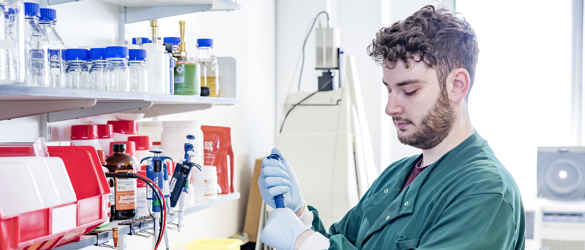 Male researcher with test tube