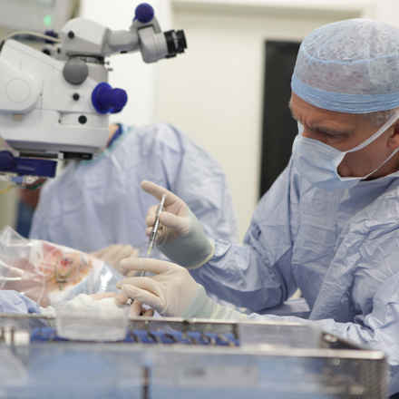 Prof MacLaren loads the virus into the injection syringe.
