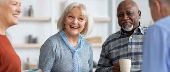 Volunteer Group smiling and drinking tea