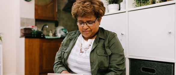 Lady looking down at tablet