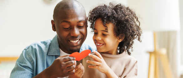 Father giving his son a heart