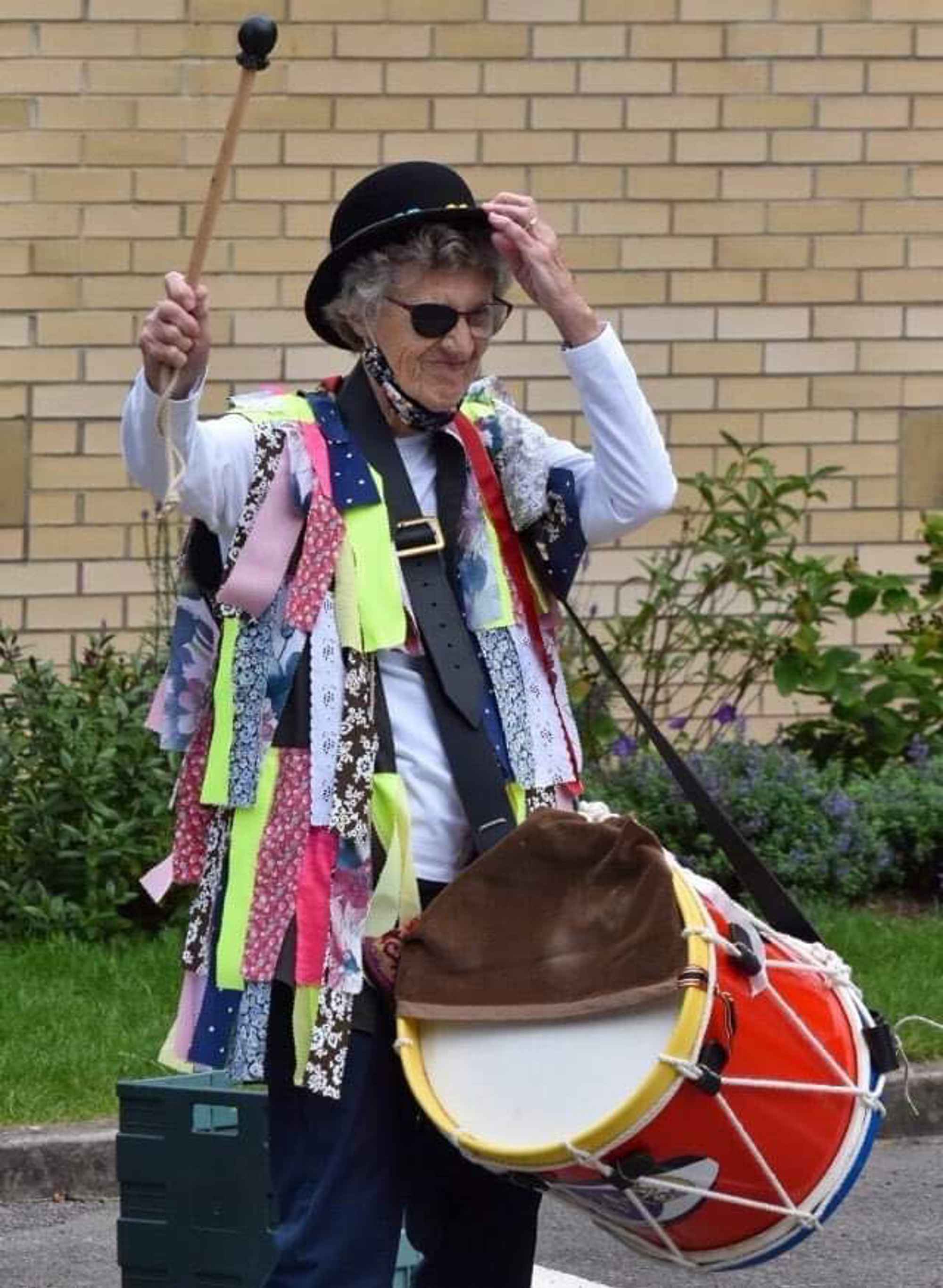 Jean Fray with drum outside