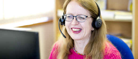 staff member on phone smiling