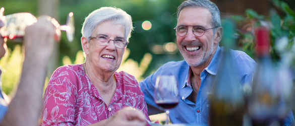 Mother and Son celebrating with food and wine in garden