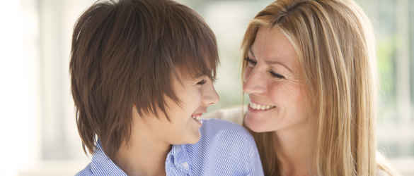 Mother and son smiling at each other