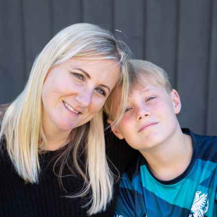 Sian with her son, Archie, smiling at the camera